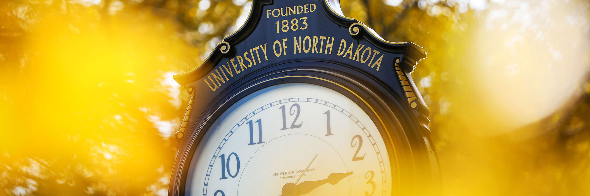Ornate clock reading "University of North Dakota, Founded 1883"