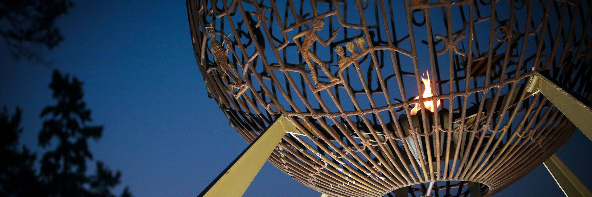 evening look at the eternal flame statue located on UND's campus