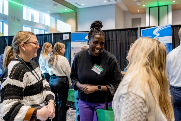 Students talking at a career expo
