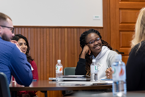 Students laughing at table