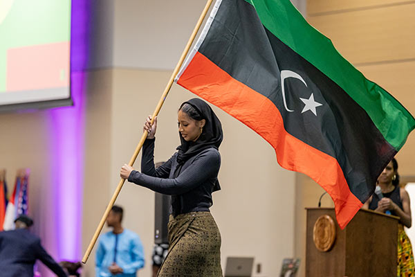 student holding flag