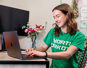 Student sitting in front of laptop