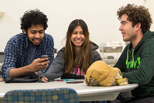 three people laughing