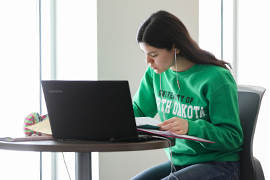 Student learning online at laptop