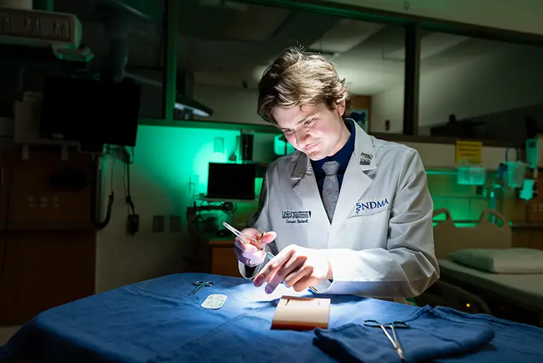 carson herbert looking at lab results at UND