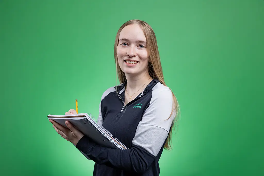 casia in green screen with notebook