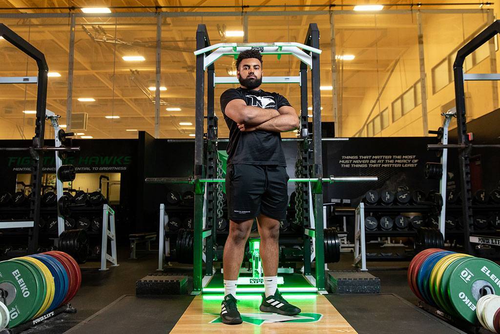 Chandon standing in weight room