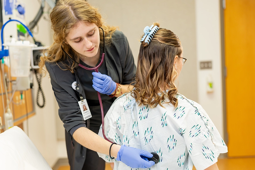 elisabeth in clinic checking on small patient
