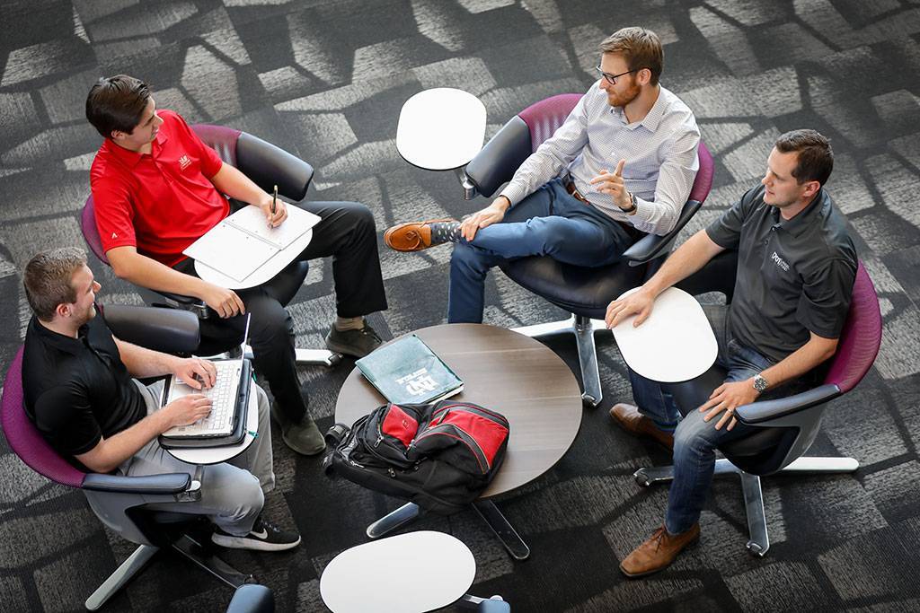 group of four sitting in chairs