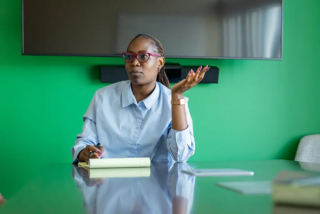 imelda contemplating data decision in classroom