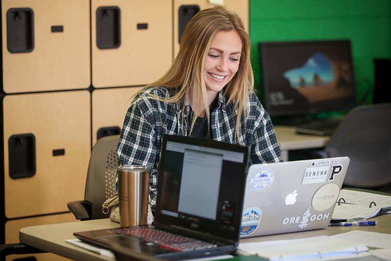 Katie Moller on laptop