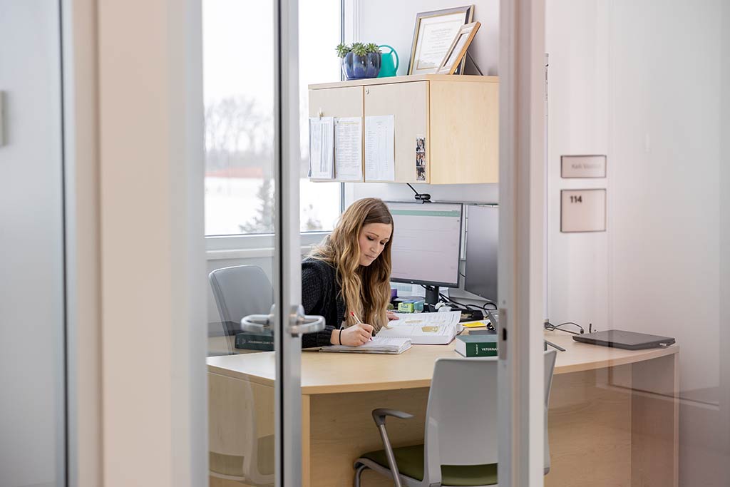 Kelli Maddock studying in her office