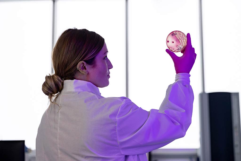 Kelli Maddock holding a petri dish