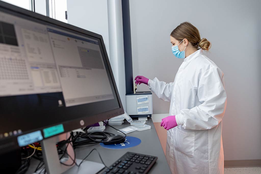 Kelli Maddock testing a sample with machine