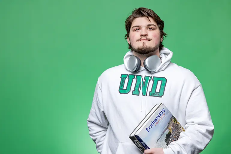 mason curtis in UND sweatshirt on campus