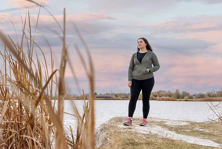 mckenzie moe standing next to frozen pond