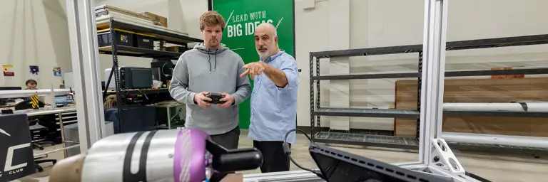 UND Aerospace Engineering Student Working in Lab with Professor