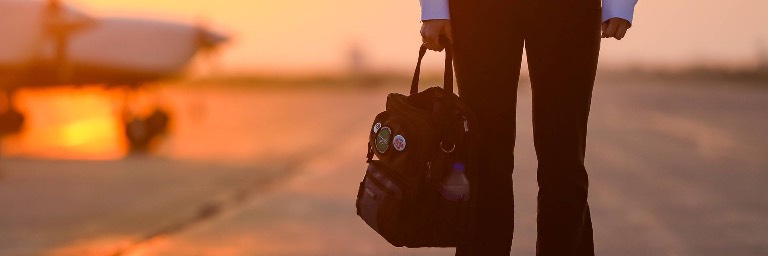 Aviation management degree student holding a bag