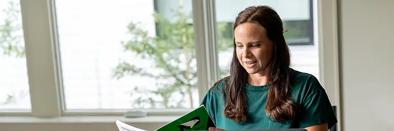 online MBA student at laptop