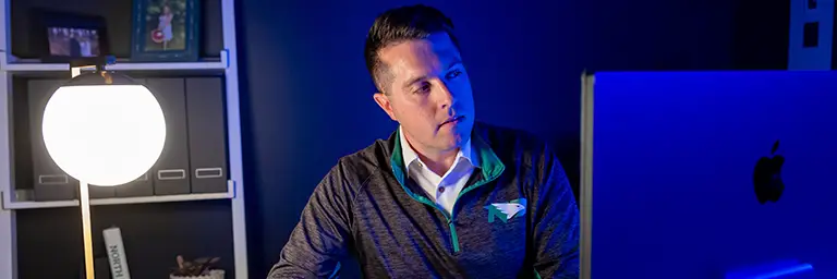 JD MBA student studying on laptop in home office