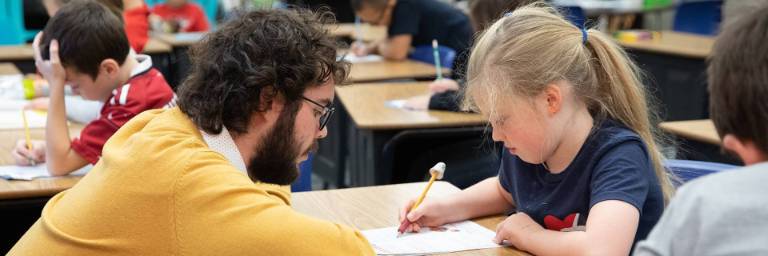Early Childhood Education student with elementary student