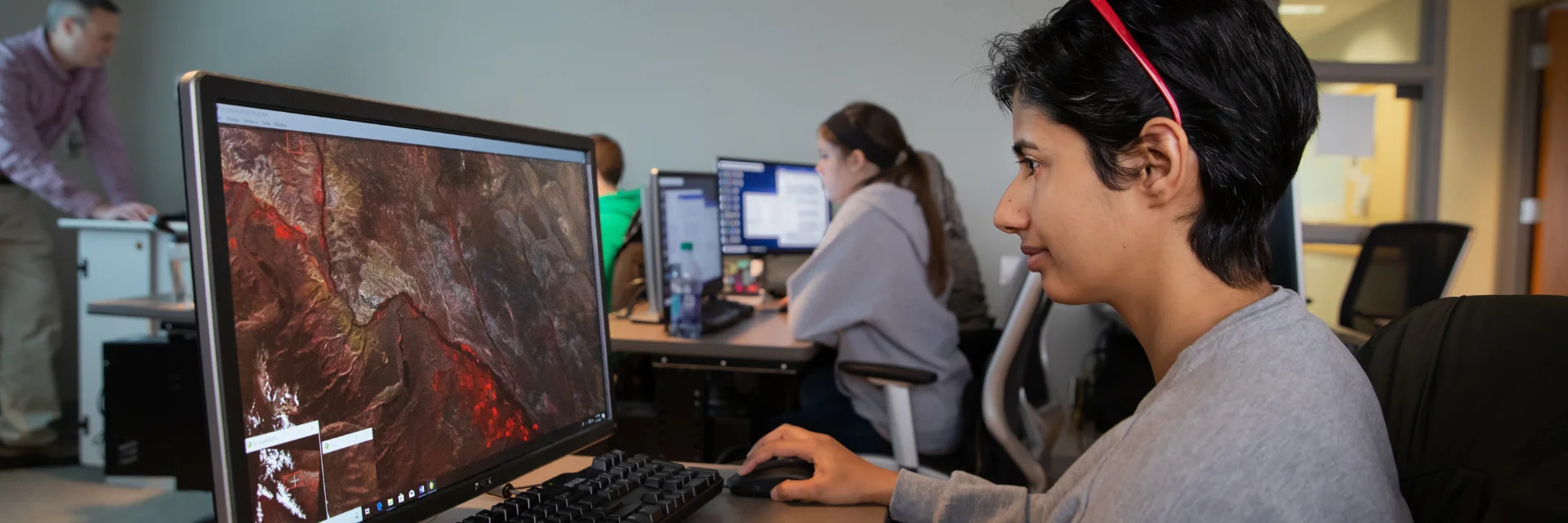 Student studying geology at the computer.