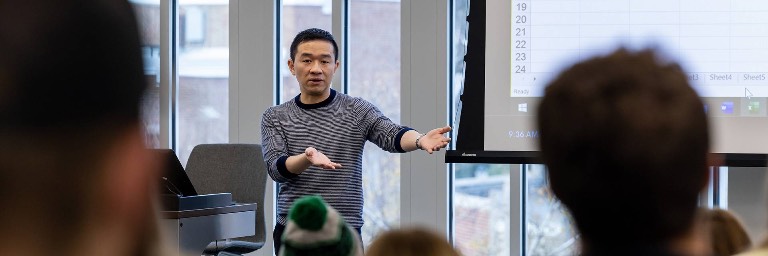 economics professor in front of class