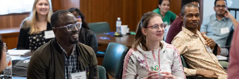 phd students listening to presentation