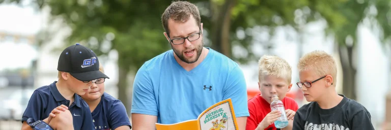 elementary reading education student with children