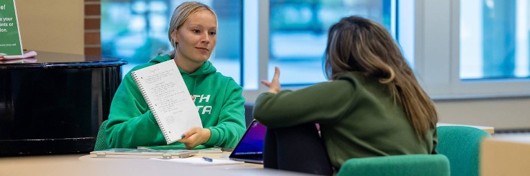 human resources degree students discussing class notes