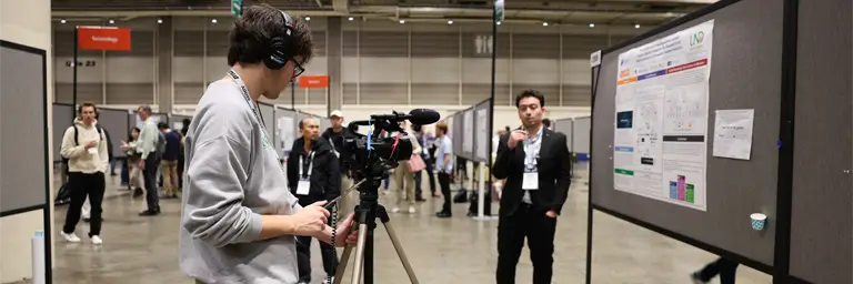 UND Journalism Student with Camera Recording Video