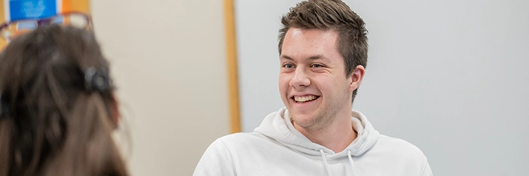 student enjoying conversation