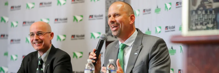 Basketball coach speaking to the media