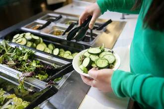 getting salad at bar