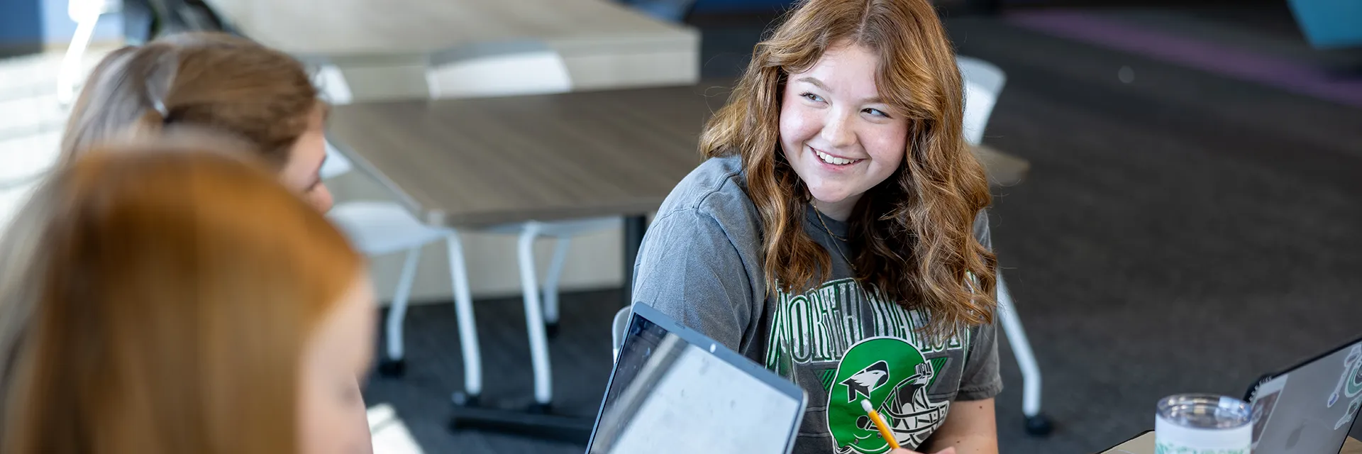 students study together in residence hall common area