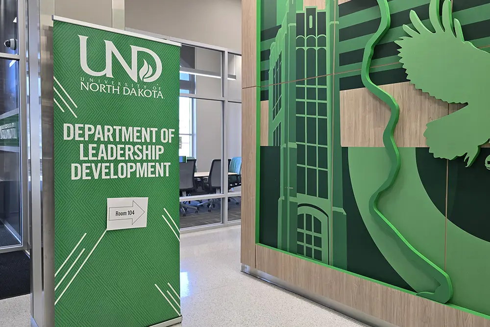 A banner pointing to the Department of Leadership Development